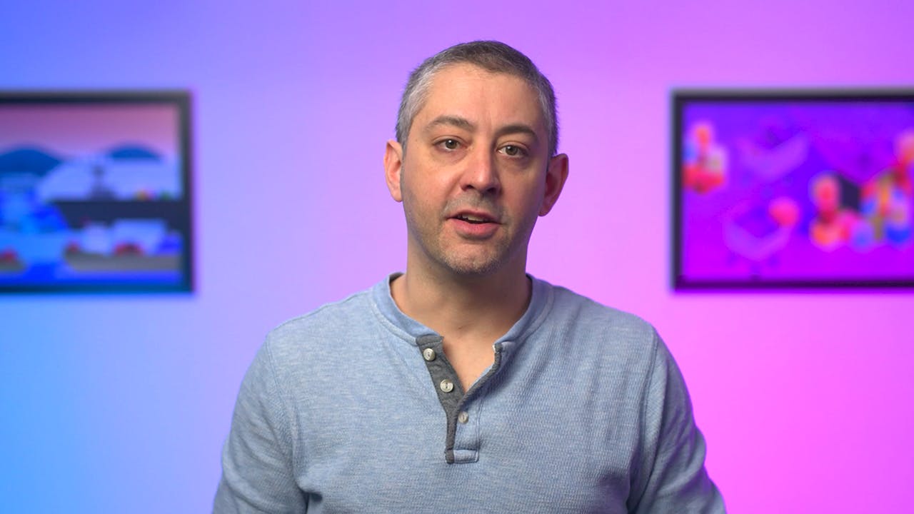 A video thumbnail captured from the 'This Month in Datadog' series; a headshot of Datadog's Director of Technical Community and Open Source dressed in casual attire and standing in front of a blue to purple gradient background.